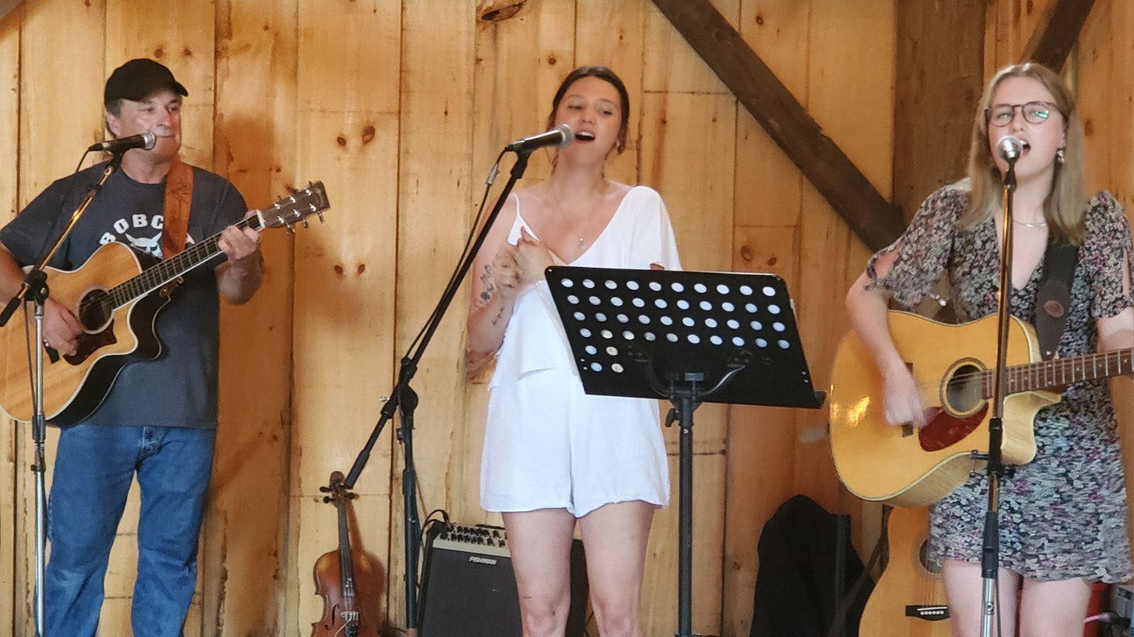 Maddie, Devyn and Paul playing in the barn